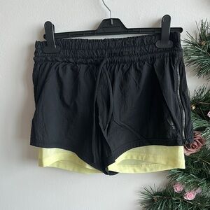 Black Women's Adidas Shorts with Yellow Lining - size Small
